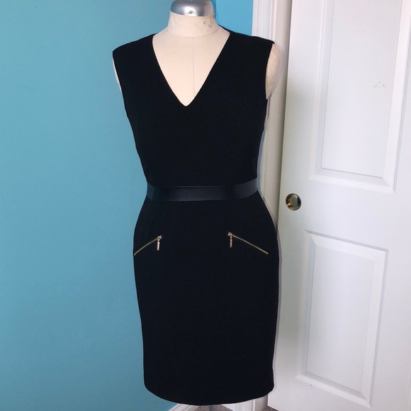 black dress with gold zipper in front